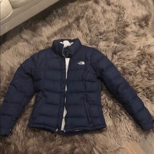 The North Face dawn jacket in dark navy color.